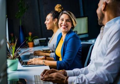 Employees working together and smiling